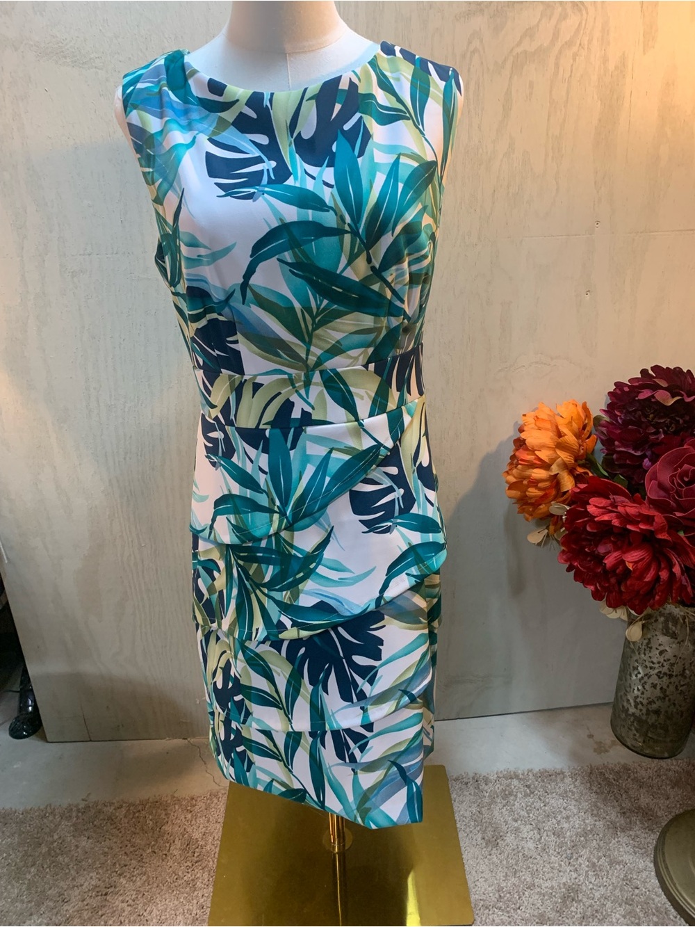 Tropical leaf sheath dress with a layered skirt bottom.